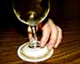 Hand on White Wine Glass